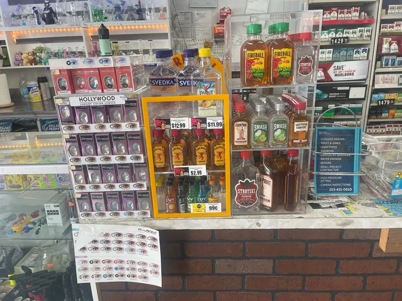 Adult smoking accessories and small-format spirits displayed at the store counter