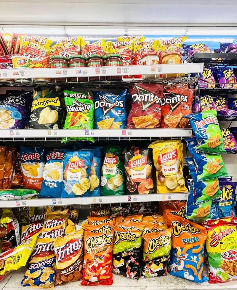 Shelves stocked with chips and savory snacks at Midland Food Center